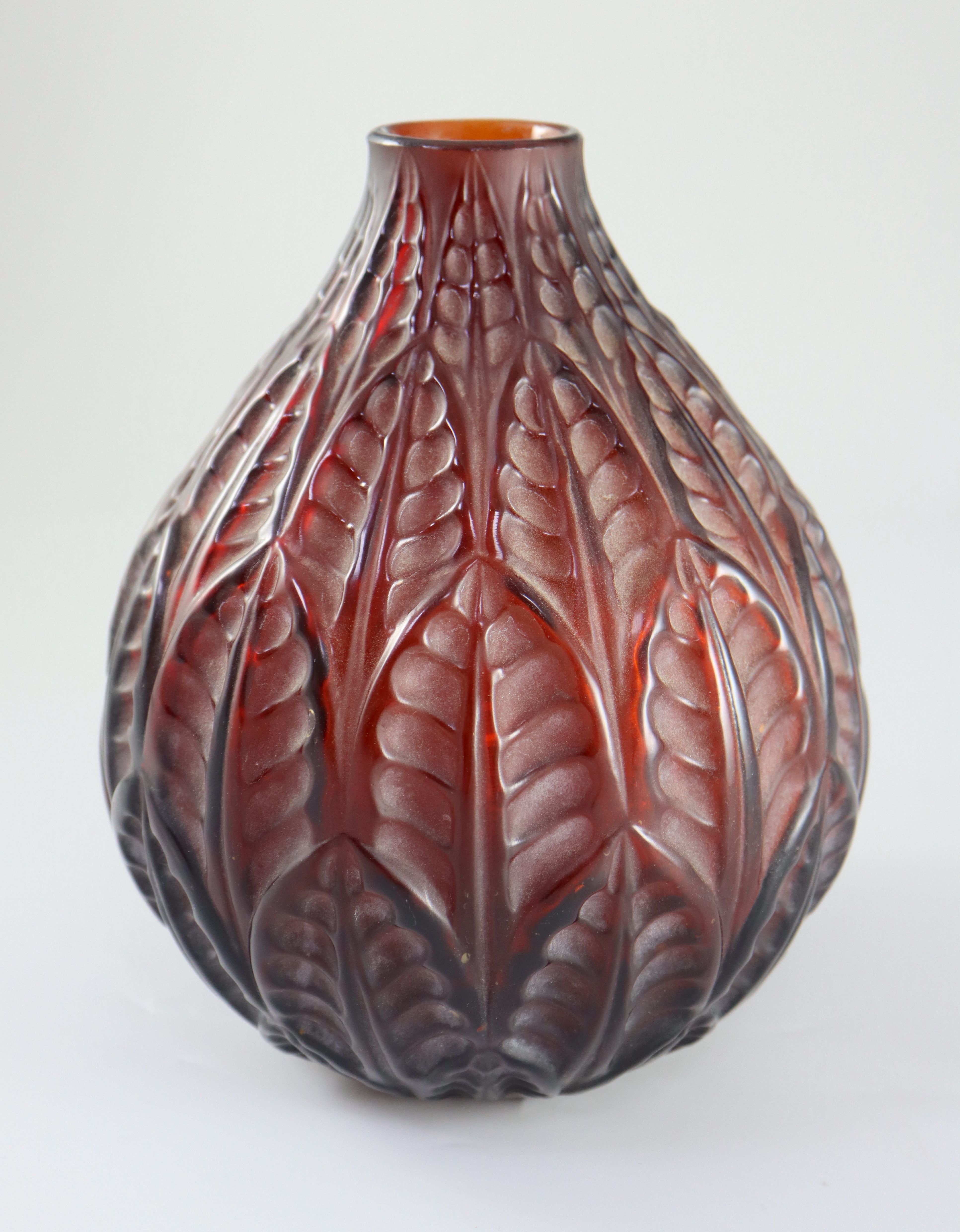 PLEASE NOTE THE NECK HAS BEEN REDUCED René Lalique. A pre-war dark amber glass Malesherbes vase, no.1014, designed in 1927, 22cm high